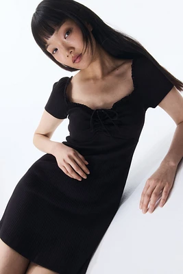 Lace-Trimmed Dress with Flared Skirt