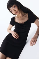 Lace-Trimmed Dress with Flared Skirt