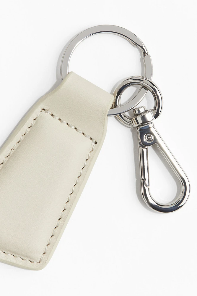 Porte-clés avec lanière en cuir