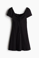 Lace-Trimmed Dress with Flared Skirt