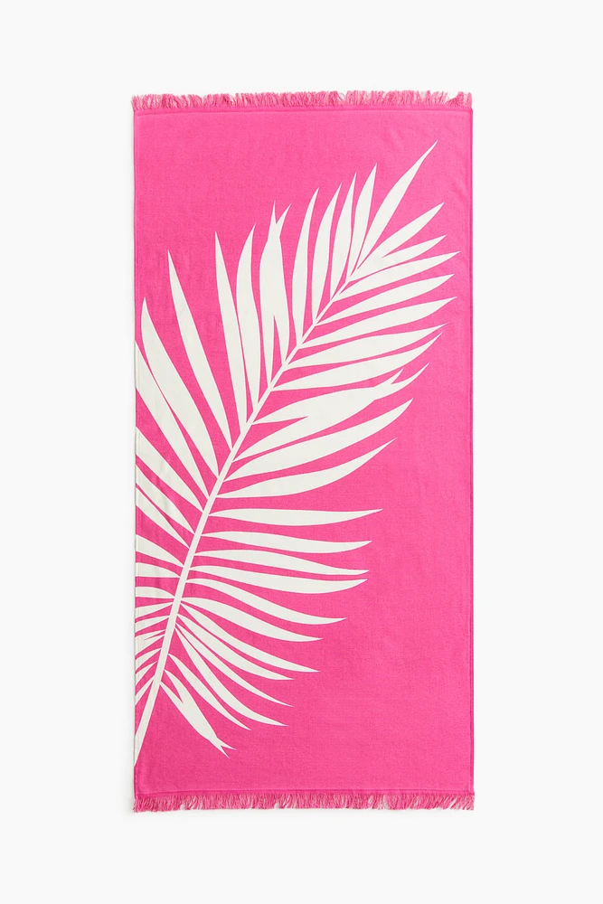 Serviette de plage frangée