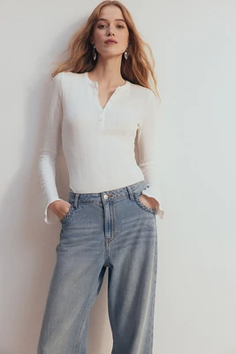 Trumpet-Sleeved Pointelle Bodysuit