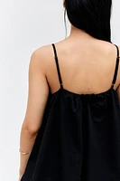 Robe à bretelles fines avec jupe effet bulle