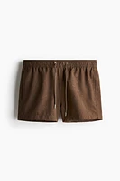 Embroidered-Pattern Swim Shorts