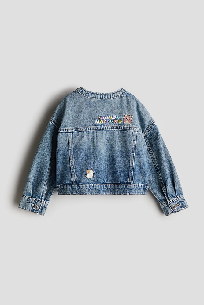 Veste en denim avec motifs brodés