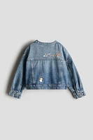 Veste en denim avec motifs brodés