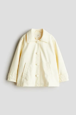 Manteau en tissu enduit
