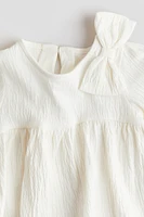 Blouse avec boucle