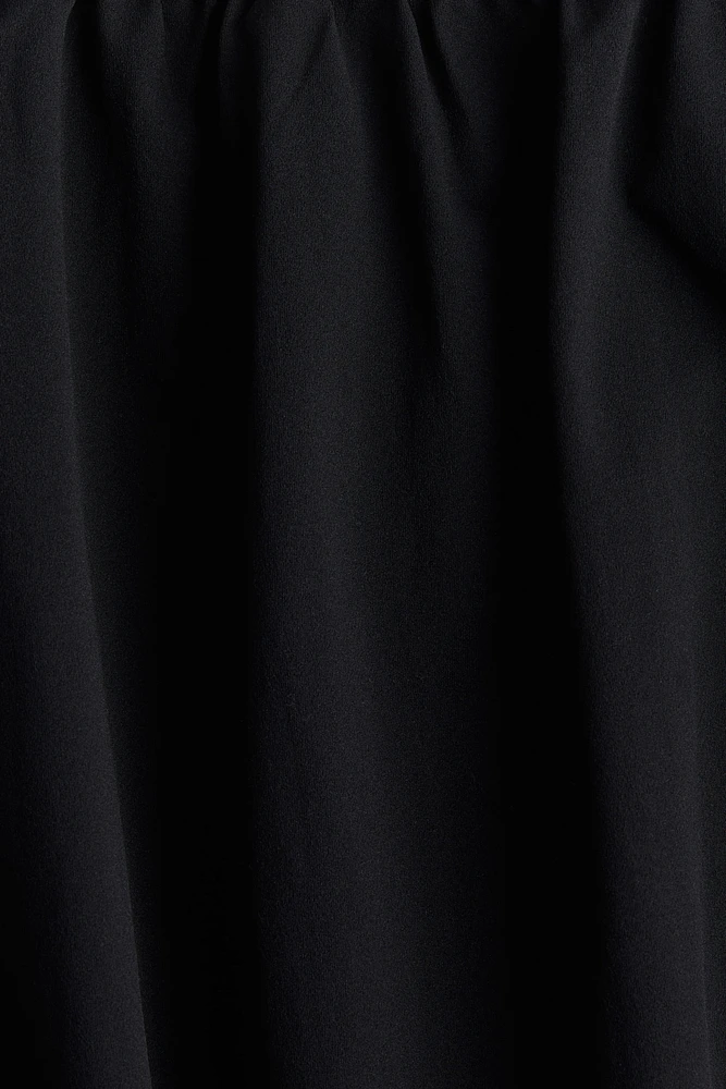 Robe à bretelles fines avec jupe effet bulle