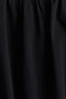 Robe à bretelles fines avec jupe effet bulle