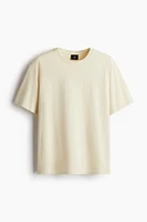 T-shirt flottant à l'aspect délavé