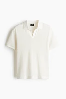 Polo classique en tricot ajouré