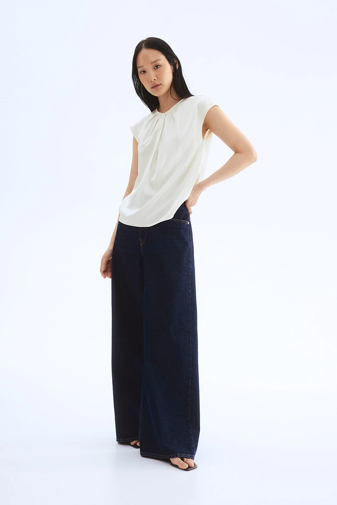 Blouse avec plis devant