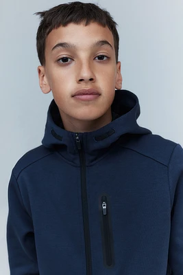 Veste de sport à fermeture éclair avec capuchon