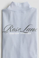 Veste à glissière avec motifs
