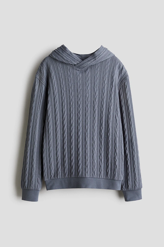 Kangourou façon tricot torsadé