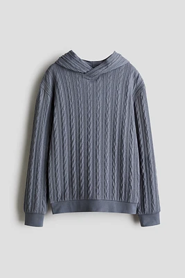 Kangourou façon tricot torsadé