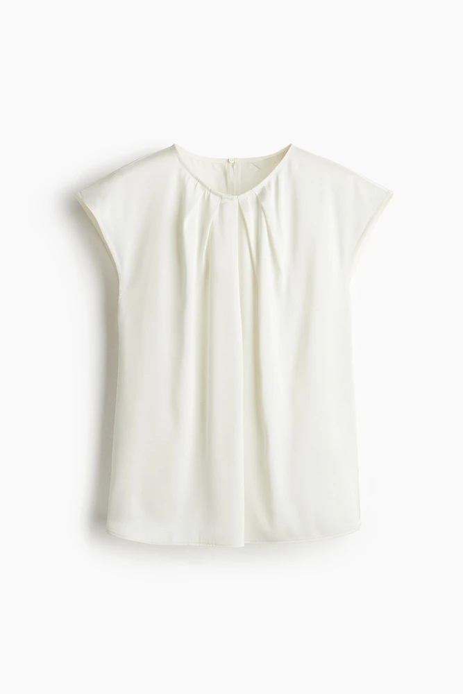 Blouse avec plis devant