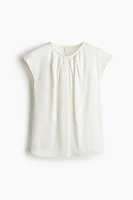 Blouse avec plis devant
