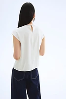 Blouse avec plis devant