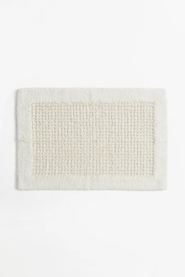 Tapis de bain en coton touffeté