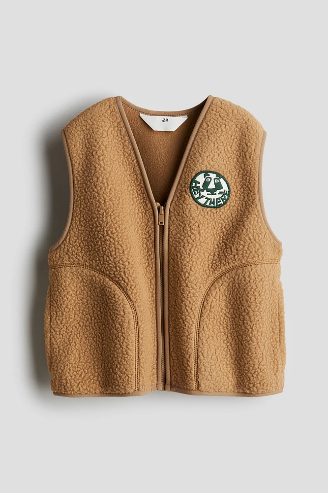 Veste sans manches en tissu peluche