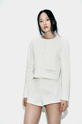 Gilet avec perles de fantaisie