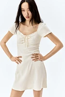 Lace-Trimmed Dress with Flared Skirt