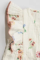 Ruffle-Trimmed Muslin Romper Suit