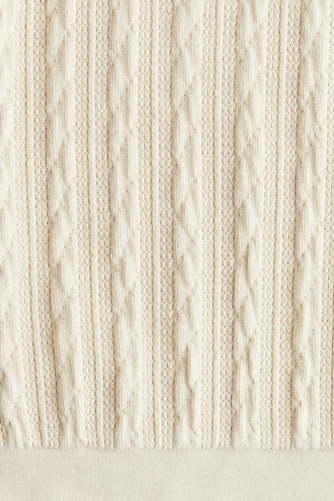 Kangourou façon tricot torsadé