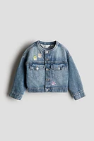 Veste en denim avec motifs brodés
