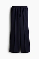Pantalon avec cordon de serrage et plis