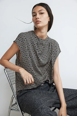 Blouse à effet drapé