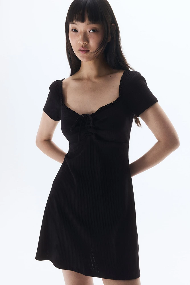 Lace-Trimmed Dress with Flared Skirt