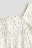 Blouse avec nid d'abeille