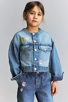 Veste en denim avec motifs brodés