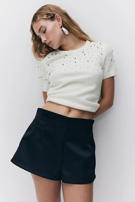 Haut ornementé en fin tricot