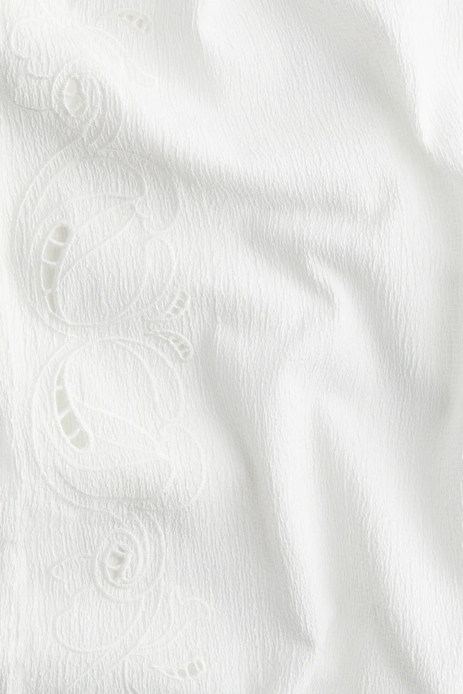 Pantalon large avec broderie anglaise