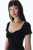 Lace-Trimmed Dress with Flared Skirt