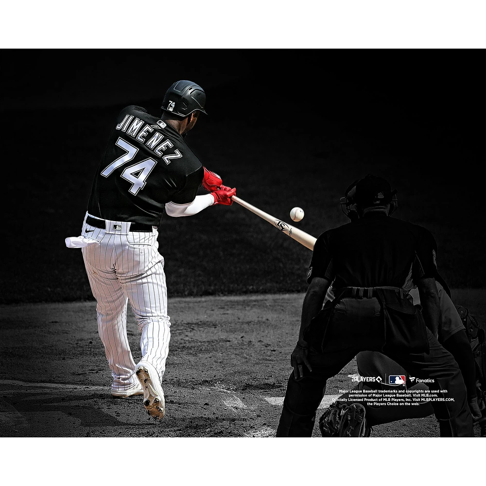 Eloy Jimenez Chicago White Sox Unsigned Hitting Black Jersey Photograph