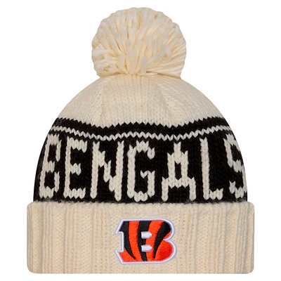 Bonnet tricoté à revers avec pompon Cincinnati Bengals 2024/25 de New Era pour femme, couleur crème
