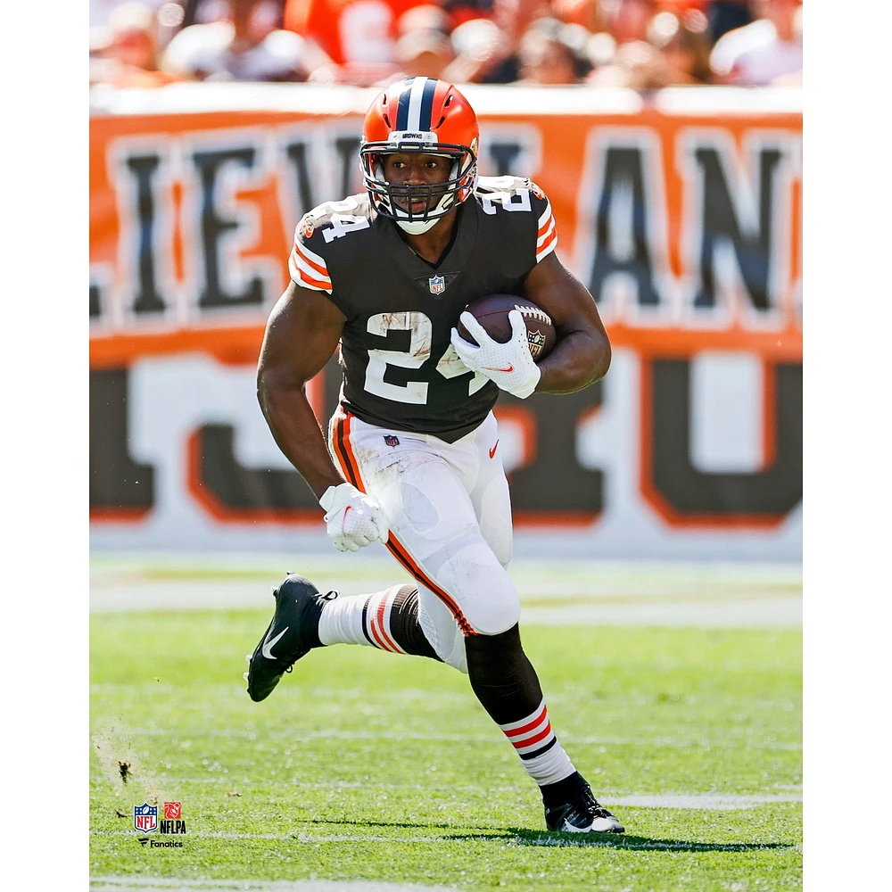 Cleveland Browns Nick Chubb Unsigned Brown Jersey Carrying Ball Photograph