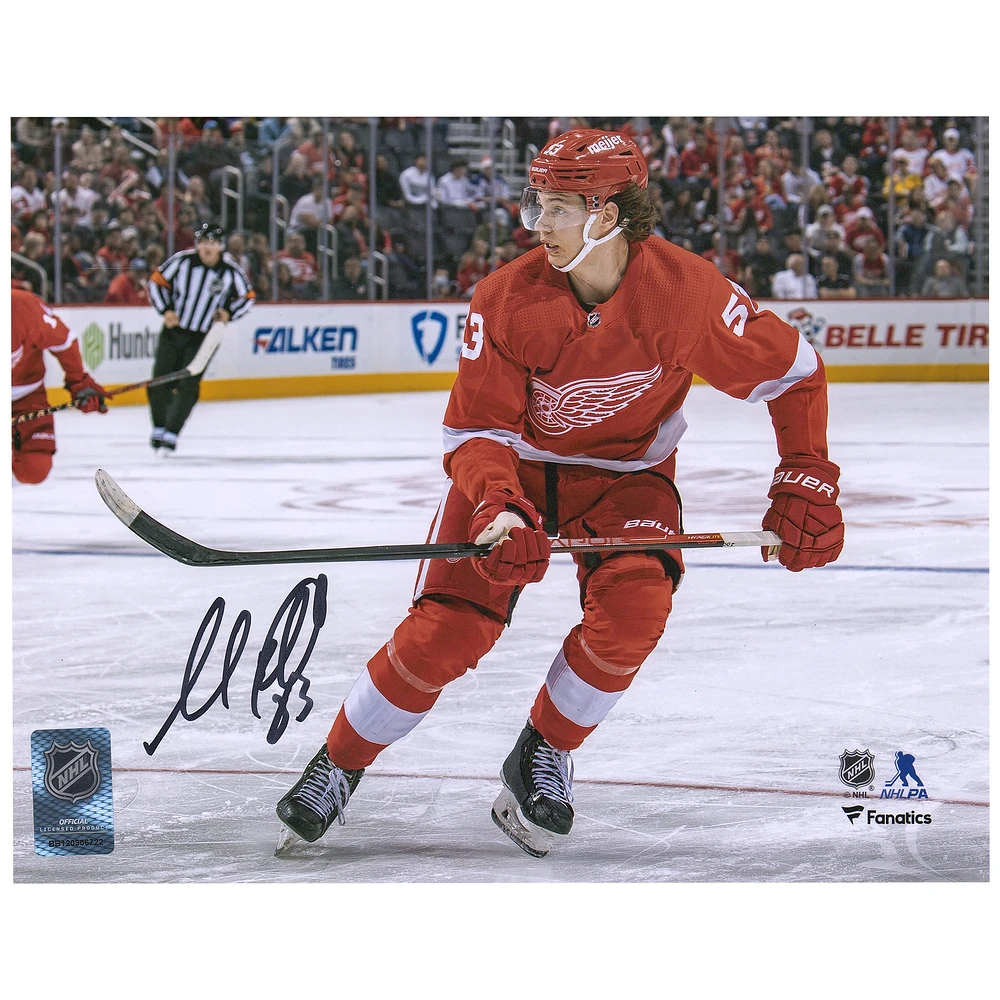 Moritz Seider Detroit Red Wings Autographed 8" x 10" Red Jersey Skating Photograph