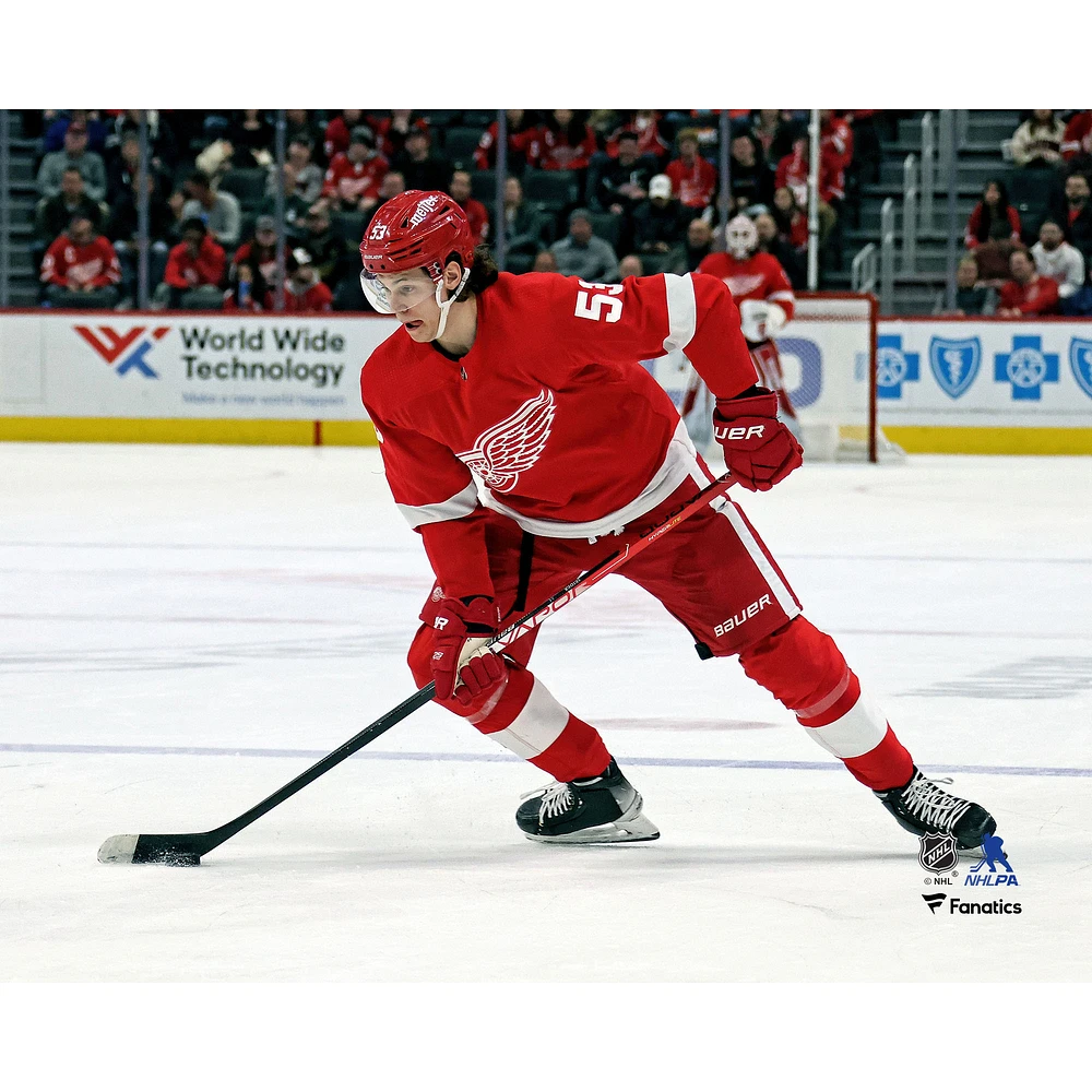 Moritz Seider Detroit Red Wings Unsigned Handling the Puck Photograph