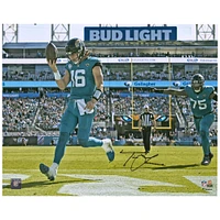 Trevor Lawrence Jacksonville Jaguars Autographed 16'' x 20'' Teal Jersey Rush Touchdown Photograph