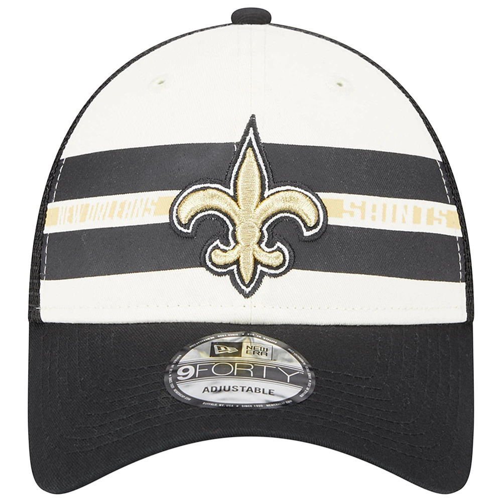 Men's New Era Cream/Black New Orleans Saints Team Stripe Trucker 9FORTY Snapback Hat