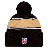 Youth New Era Black New Orleans Saints 2024 Sideline Sport Cuffed Knit Hat with Pom