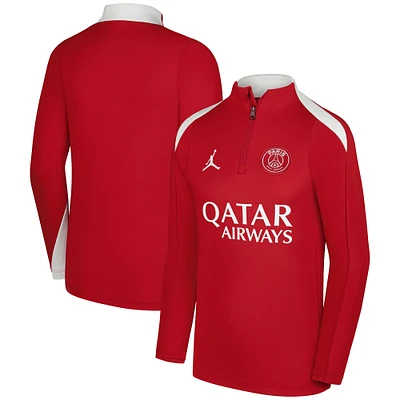 Haut à enfiler Jordan Brand rouge Paris Saint-Germain 2025/26 Strike Drill Performance quart de zip pour jeunes