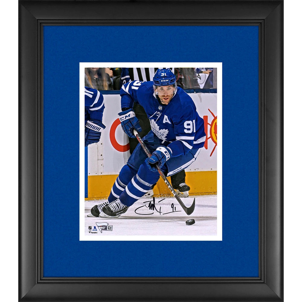 John Tavares Toronto Maple Leafs Framed Autographed 8" x 10" Blue Jersey Skating with Puck Photograph