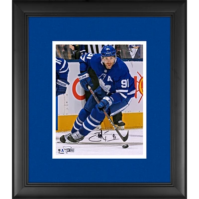 John Tavares Toronto Maple Leafs Framed Autographed 8" x 10" Blue Jersey Skating with Puck Photograph